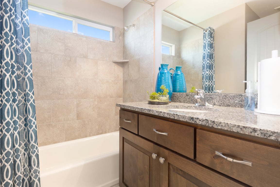 Gorgeous bathroom with dark wood cabinetry