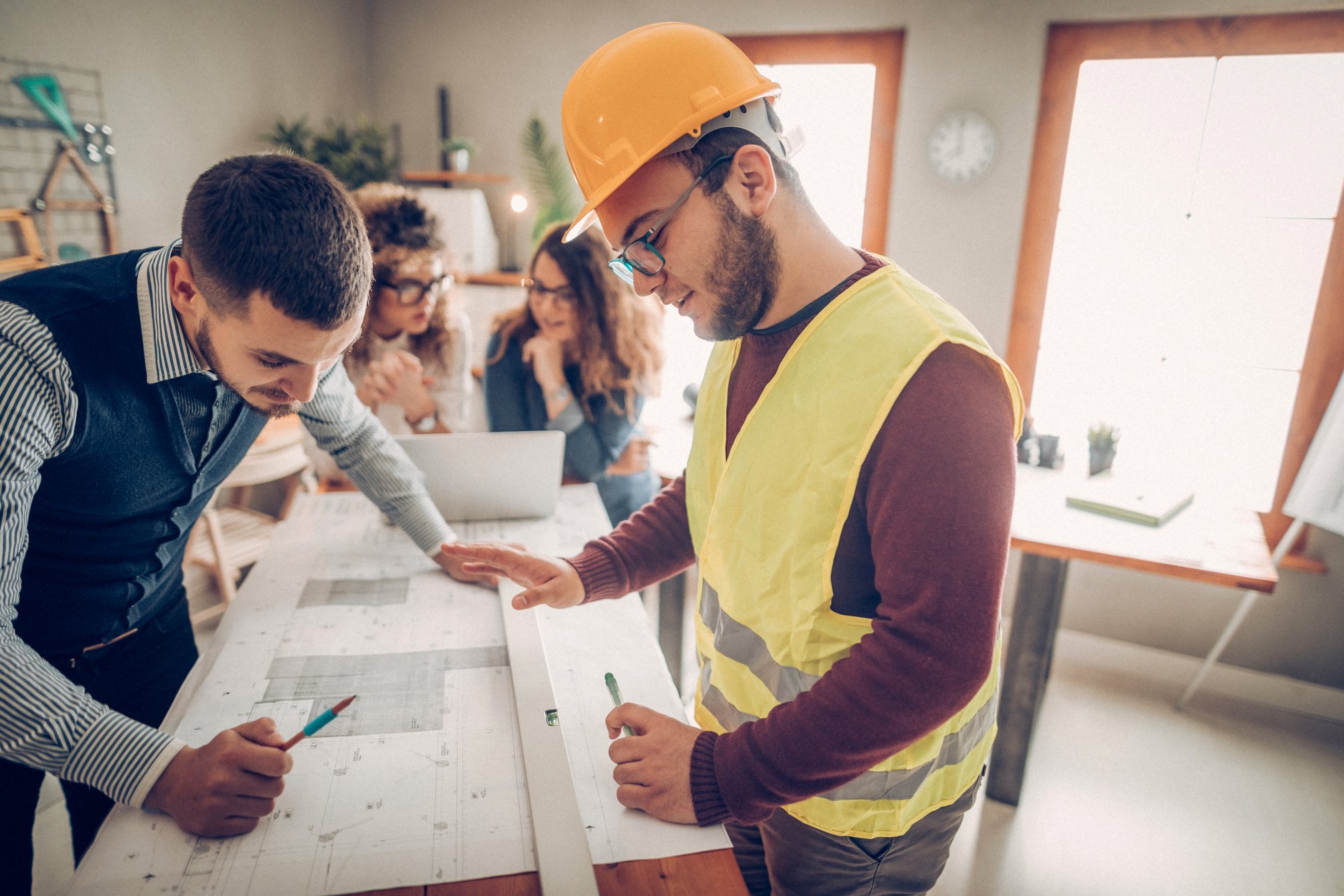 Consulting a construction worker