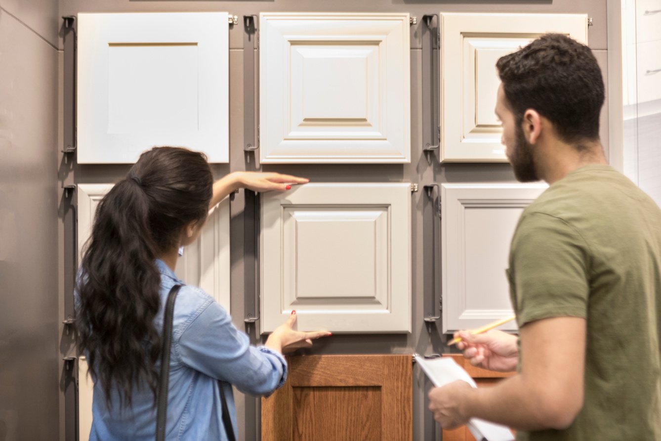 Woman shops for cabinetry in hardware store